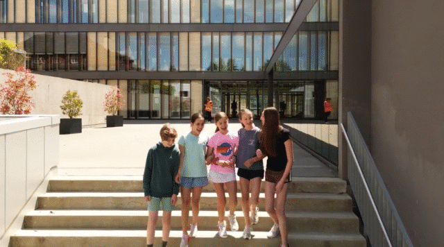 Middle School students walking down the campus steps at ISZL.